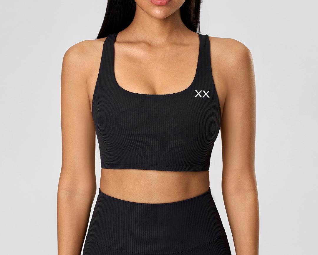 Blackout Barbell Vera bra featuring soft fabric, supportive design, and adjustable straps, shown in a close-up view.