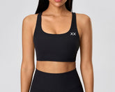 Blackout Barbell Vera bra featuring soft fabric, supportive design, and adjustable straps, shown in a close-up view.