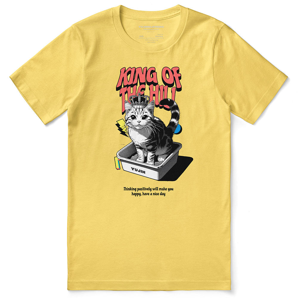 Yūjin Clothing King of the Hill cat T-Shirt featuring a graphic of a proud cat wearing a crown on a casual tee.