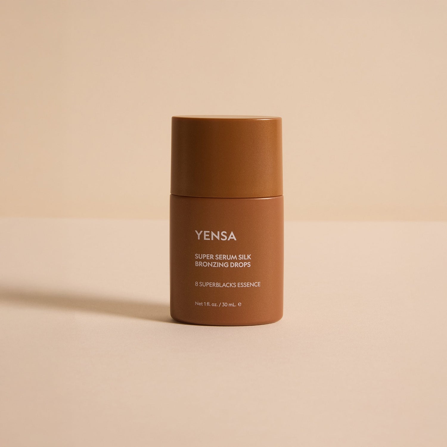 YENSA Super Serum Silk Bronzing Drops in a dropper bottle, showcasing the luxurious bronzer formula and sleek packaging.