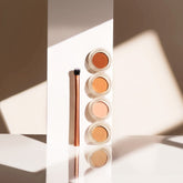 YENSA Super Bright Dark Circle Serum Peptide Corrector in various shades, featuring a sleek eye corrector tube with applicator tip.