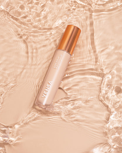 YENSA Super Serum Silk Concealer makeup tube with applicator on a neutral background, showcasing smooth, silky concealer formula.