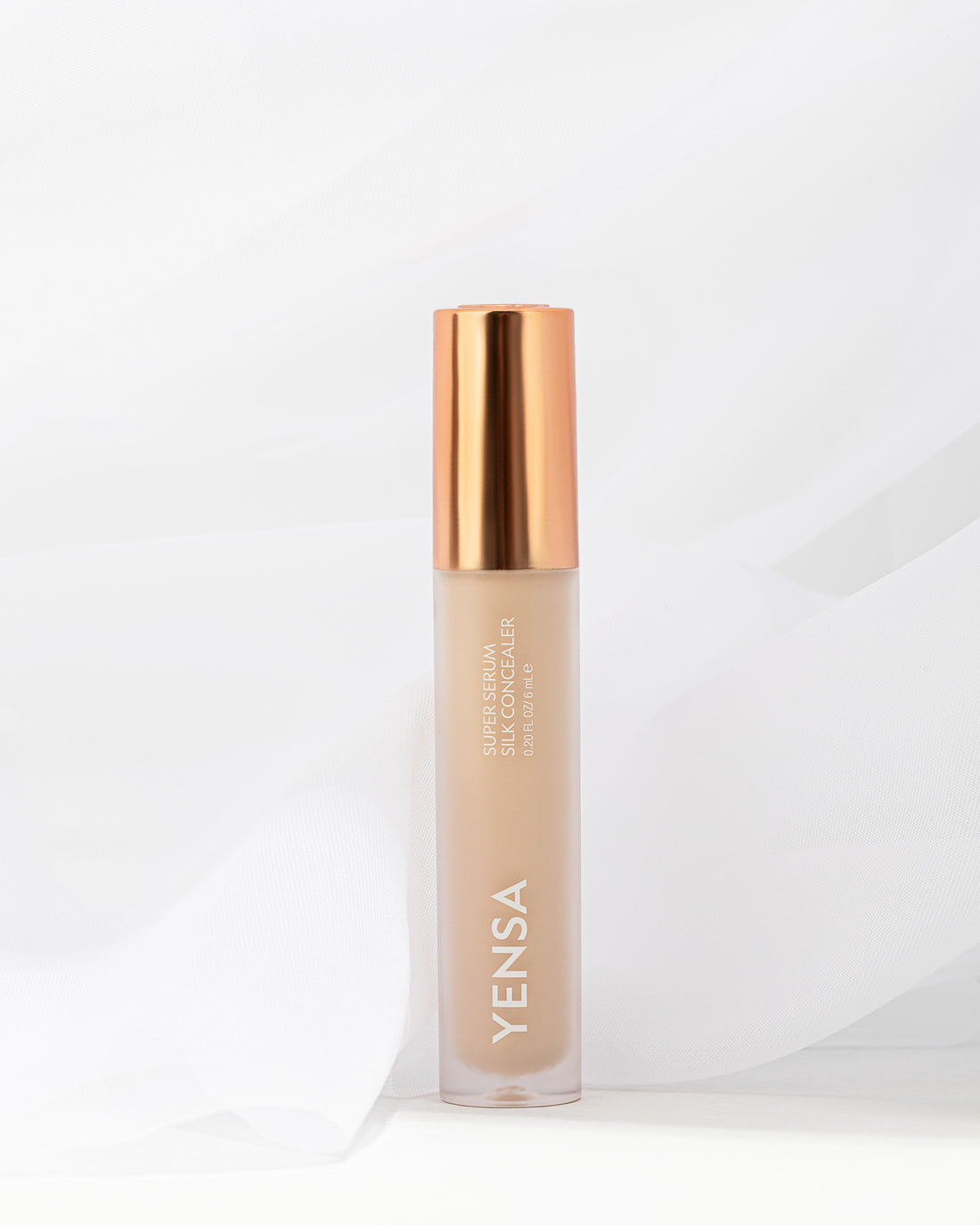 YENSA Super Serum Silk Concealer makeup tube with applicator, smooth and creamy formula for flawless skin coverage.