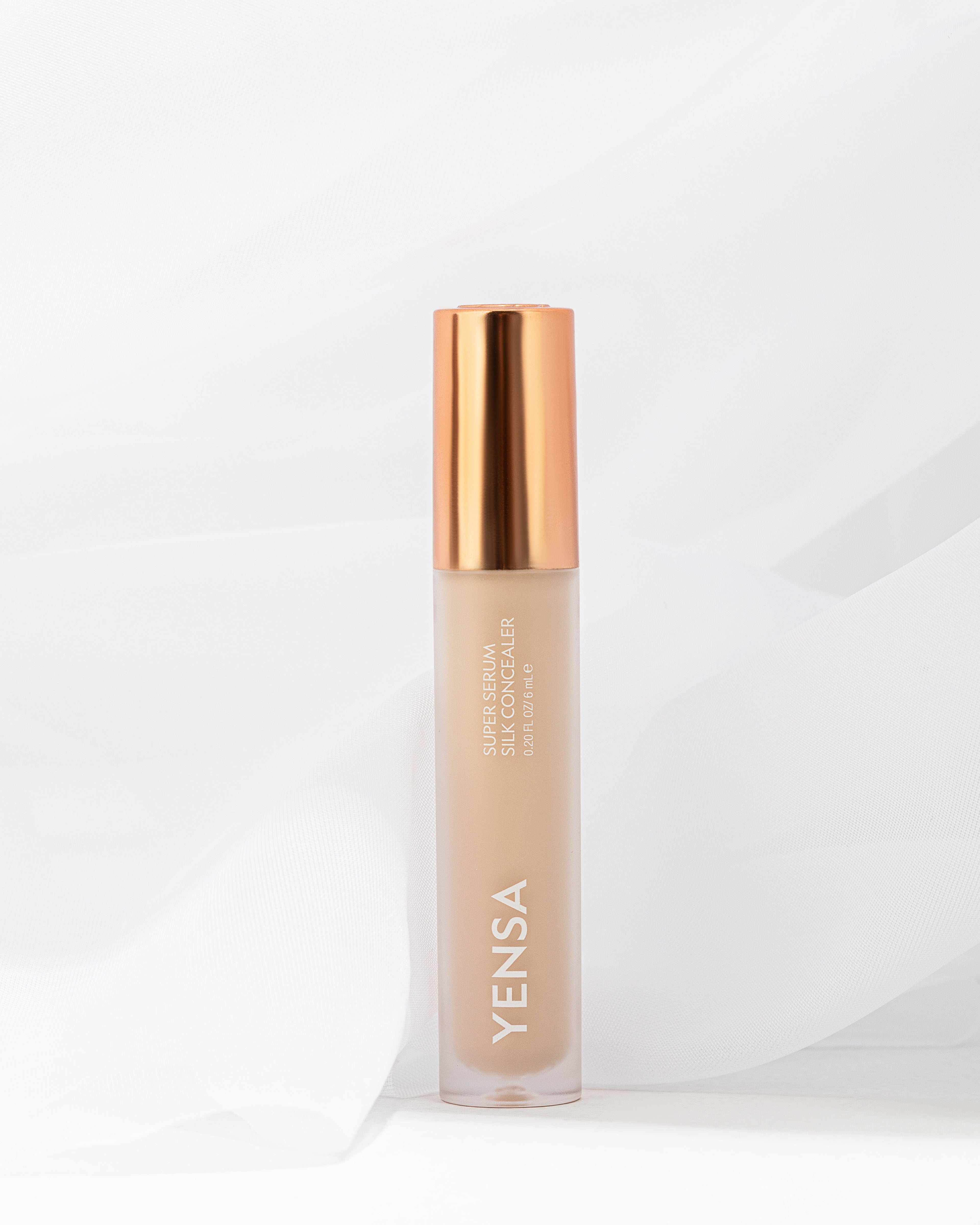 YENSA Super Serum Silk Concealer makeup tube with applicator, smooth and creamy formula for flawless skin coverage.