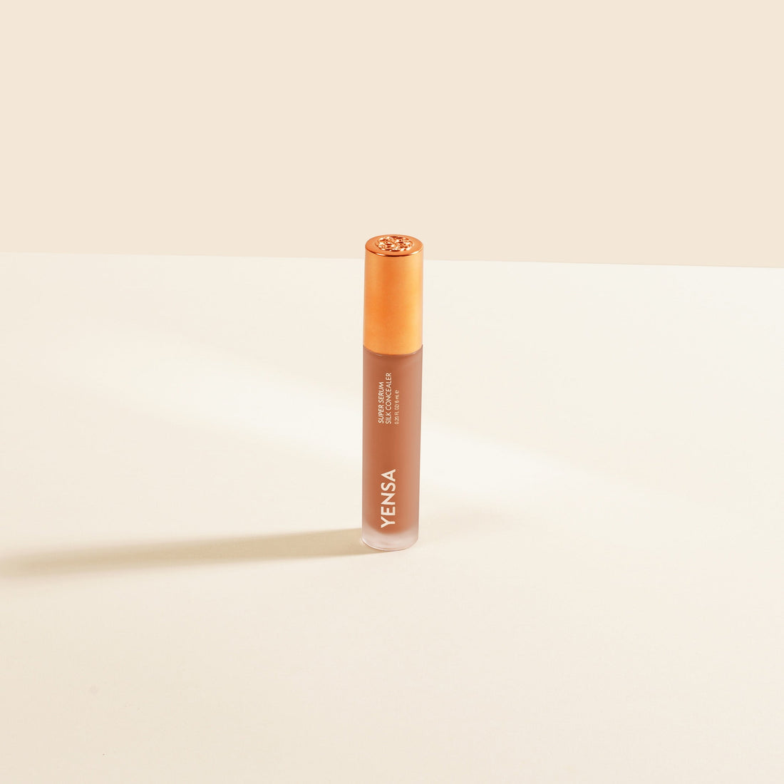 YENSA Super Serum Silk Concealer in Deep 2, makeup product with smooth, creamy texture and natural finish for concealing imperfections.