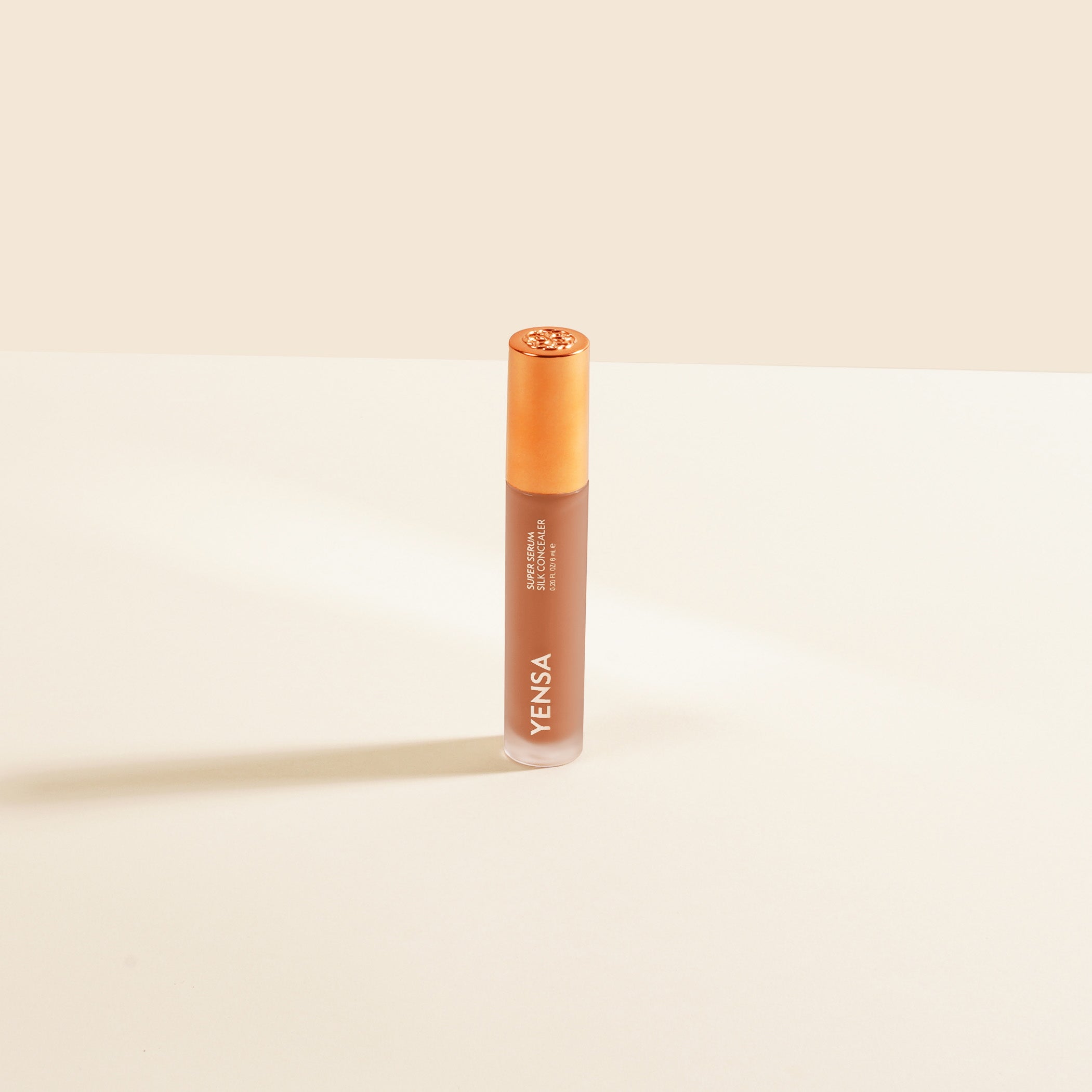 YENSA Super Serum Silk Concealer in Deep 2, makeup product with smooth, creamy texture and natural finish for concealing imperfections.