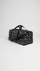 Yūjin Clothing Honey Duffle Bag, stylish canvas duffle with leather accents, featuring handles and a zippered main compartment.
