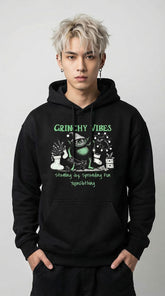 Yūjin Clothing Grinchy Vibes Christmas hoodie featuring a festive Grinch design and cozy fabric, perfect for holiday wear.