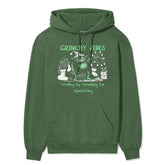 Yūjin Clothing Grinchy Vibes Christmas hoodie featuring a festive green and red design with a fun Grinch graphic.