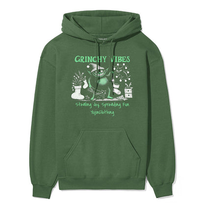 Yūjin Clothing Grinchy Vibes Christmas hoodie featuring a festive green and red design with a fun Grinch graphic.