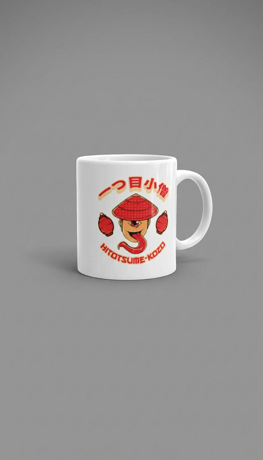 Yūjin Clothing Hitotsume-Kozō Mug featuring a playful one-eyed face design on a ceramic mug, perfect for enjoying beverages.