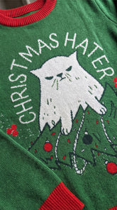 Yūjin Clothing Christmas Hater Cat sweatshirt featuring a humorous design with a cat graphic and festive holiday theme.