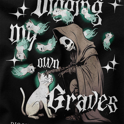Yūjin Clothing Digging My Own Graves cat T-Shirt featuring a graphic design with a cat and edgy text on a black cotton tee.