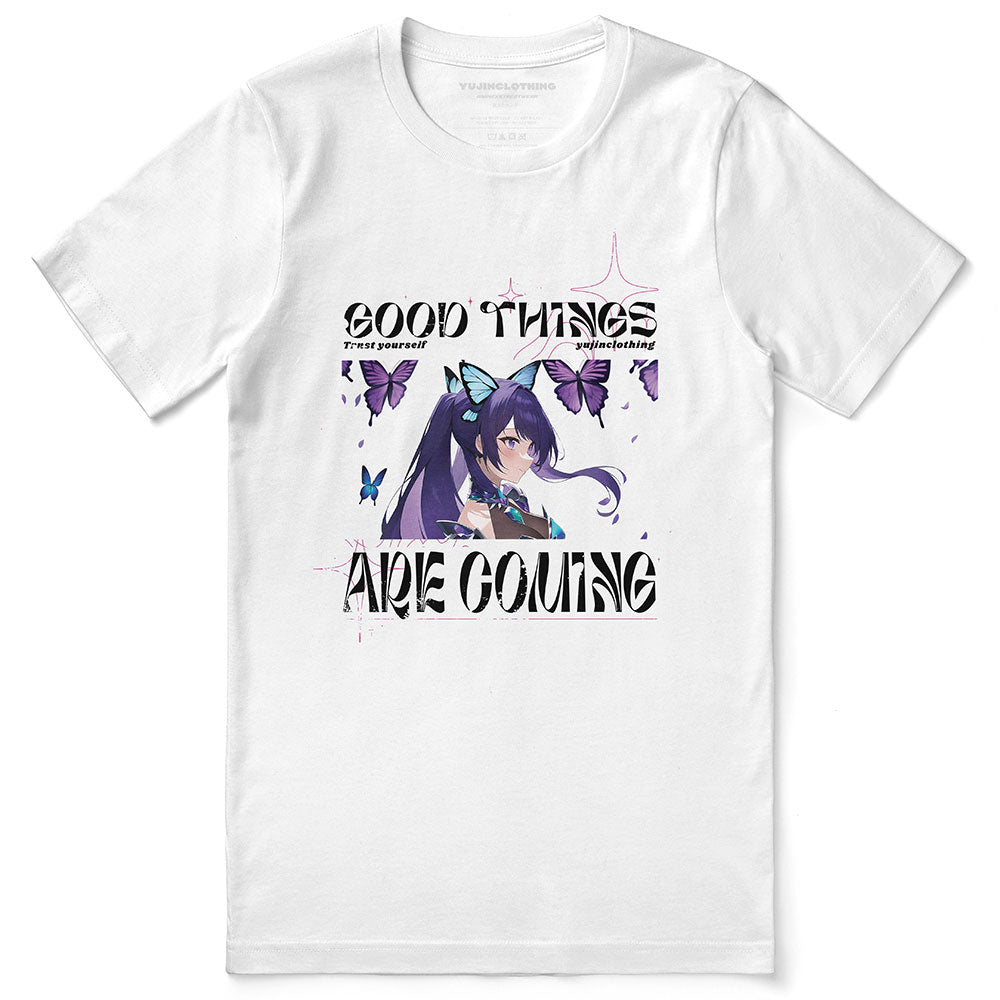 Yūjin Clothing Good Things Are Coming T-Shirt displayed flat, featuring a white cotton T-shirt with motivational text design.