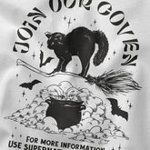 Yūjin Clothing Join Our Coven cat T-Shirt featuring a witchy design with a black cat and moon print on a comfortable black cotton tee.